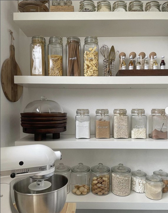 Organised kitchen pantry with labelled jars